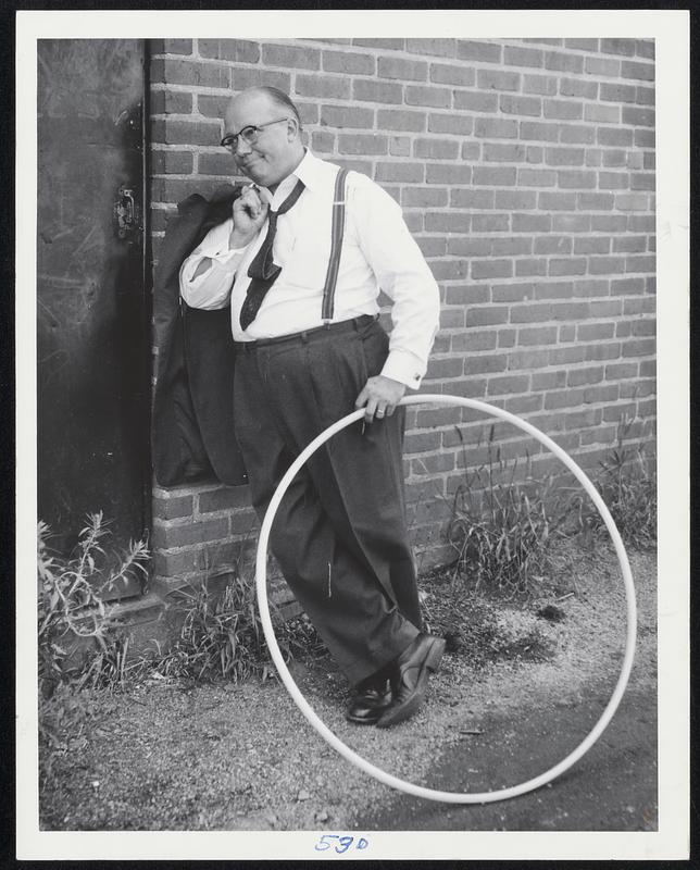 Don Carr, manager, F.W. Woolworth, Wollaston Branch, President Wollaston Businessmens’ Association, with hula hoop