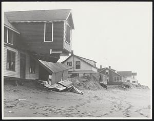 The Wild Waves' Harvest at the Plum Island shore, where the recent hurricane whipped away the sand bluff that supported the house in the foreground, causing its collapse, and left several others exposed to any future assault of the sea.