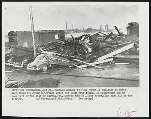 Tornado Damage at Port Huron--A building is shown demolished following a tornado which hit this city today. In background can be seen part of the city of Sarnia, Ont., across the St. Clair River, also hard hit by the twister.