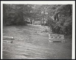 Summer Settee Awash-Garden furniture sailed away when a brook overflowed in the Walnut Street-Cabot Woods section of Newton.