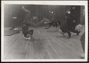 Young men breakdancing