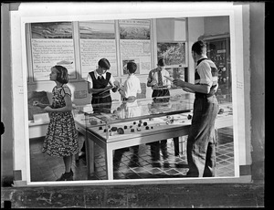 Children do an activity in an exhibit