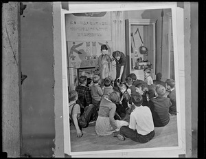 Children sitting for a lecture in front of Egyptian and South African exhibits
