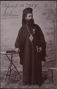 A Greek priest of the Orth. Church. They all wear these caps