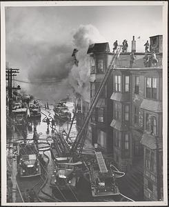 Fire fighters battling building fire, Boston