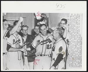 Spahn Happy After 20th Win--Warren Spahn (21) smiles happily as he receives congratulations from teammates in dressing room here today immediately after he had posted his 20th win of the season and all but crushed any hopes Cincinnati had remaining for the National League pennant. At right is Braves' manager Fred Haney and back of Haney is Gene Conley. At left is Del Rice and next to him is Frank Torree. Other player are unidentified.