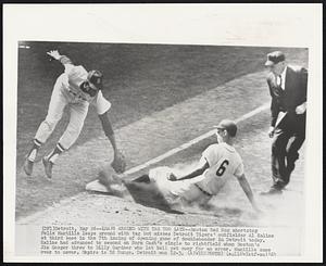 Detroit – Leaps Around With Tag Too Late – Boston Red Sox shortstop Felix Mantilla leaps around with tag but misses Detroit Tigers’ outfielder Al Kaline at third base in the 7th inning of opening game of doubleheader in Detroit today. Kaline had advanced to second on Norm Cash’s single to rightfield when Boston’s Jim Gosger threw to Billy Gardner who let ball get away for an error. Mantilla came over to cover. Umpire is Ed Runge. Detroit won 12-3.