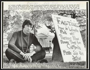 Brian McDonnell, 27, formerly assistant director of the Health and Welfare Council of Delaware County in Pennsylvania, sits in Lafayette Park across from the White House 6/1. Ee is fasting until all U.S. troops have been removed from Cambodia. He began his fast on May 3. Occasionally he sips water and takes a salt tablet. So far, McDonnell has lost 35 lbs.