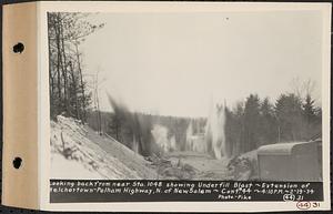 Contract No. 44, Extension of Belchertown-Pelham Highway, New Salem, Orange, looking back from near Sta. 1048 showing underfill blast, New Salem, Mass., Feb. 19, 1934