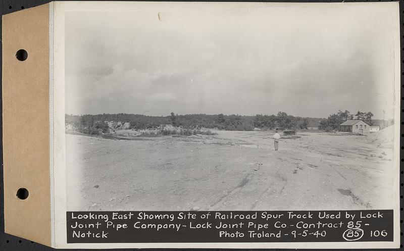 Contract No. 85, Manufacture and Delivery of Precast Concrete Steel Cylinder Pipe, Southborough, Framingham, Wayland, Natick, Weston, looking east showing site of railroad spur track used by Lock Joint Pipe Co., Natick, Mass., Sep. 5, 1940