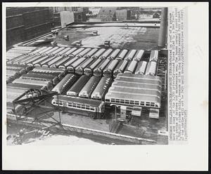 Strike-Enforced Storage - Parked on roof of a garage here are some of the 3,500 privately-owned buses idled by a New Year's Day strike of drivers and maintenance men. The buses normally carry about 3,500,000 riders daily. Because of the long holiday weekend full impact of the strike will not be felt until Monday.