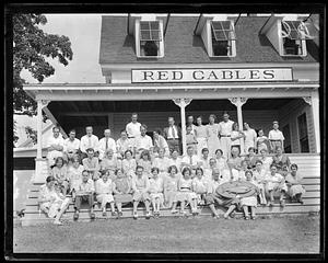 A group of people posing in front of "Red Gables"
