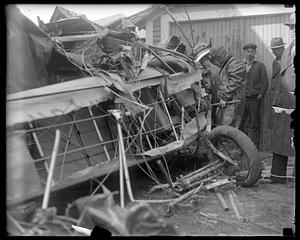 Navy plane crashes into house at Quincy, MA. Two men live by jumping with parachutes