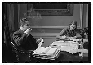 A man seated at a desk