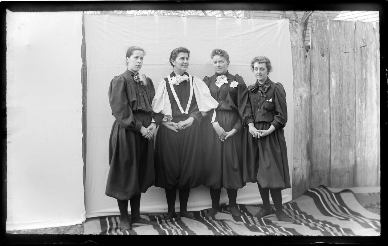 Four female Normal School students in gym uniforms