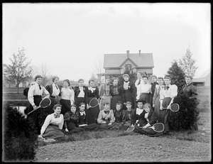 Group of female Normal School students with tennis rackets in Boyden Park