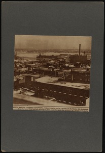 Snow mantle covered rooftops: aerial view of New Bedford, MA