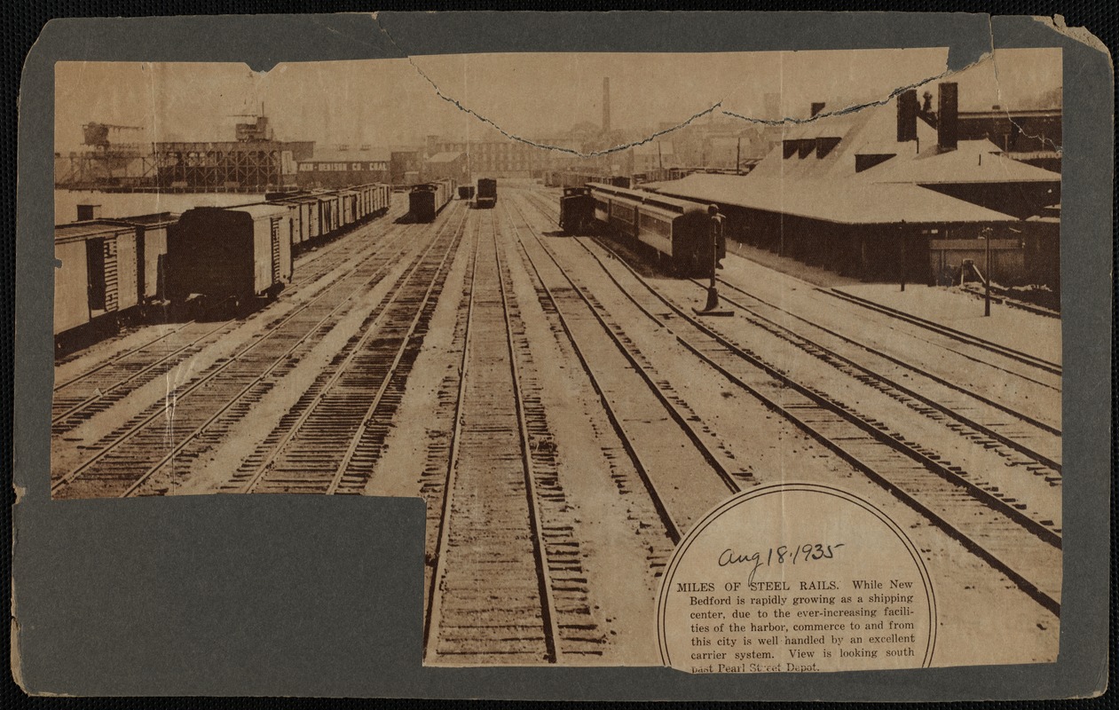 Miles of steel rails: view of railroad tracks and cars looking south past Pearl Street Depot, New Bedford, MA