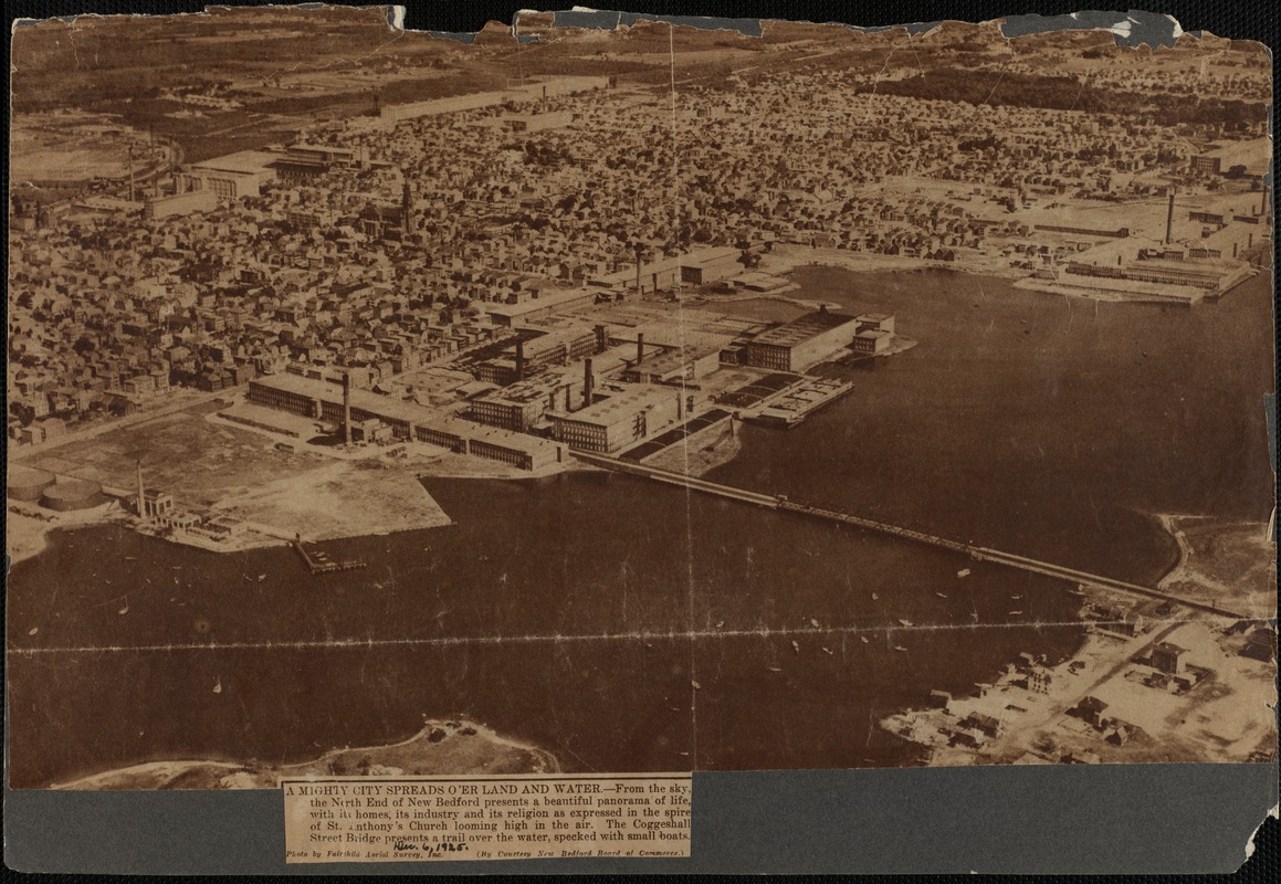 A mighty city spreads o'er land and water: aerial view of north end of New Bedford, MA