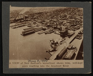 Aerial view of New Bedford, MA waterfront showing piers and Acushnet River