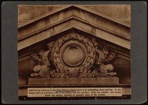 Ornate pediment with wreath cartouche and dolphin on each side, above entrance to First National Bank building, New Bedford, MA