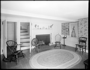 Roger G. Pierce east room with fireplace and two open doors, stairway seen through one door (interior)