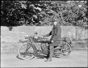 Phillip Smith on Indian motorcycle, Perkins Street, near Ward's Pond