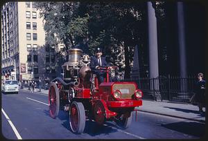 Antique fire engine in parade, Tremont Street, Boston