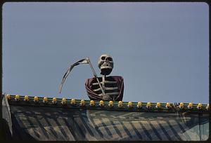 View of skeleton figure holding scythe