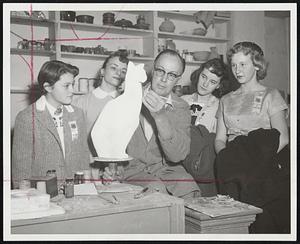 Ceramic Cat takes form at the Massachusetts School of Art under the craftsmanship of Associate Prof. Charles Abbott as a group of 4-H girls watch during a Teen Tour of vocational possibilities in Boston. From left are Valerie Roy, Peabody; Marie McLean, Peabody; Barbara Bankart, Canton, and Pamela Thompson, Framingham.