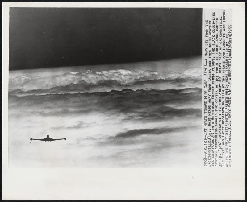 Jet Heads Toward Hurricane 'Eye'--A Navy jet from the Jacksonville, Fla., base heads away from camera and into rough weather yesterday (Aug. 9) on a Hurricane Connie photo flight. The black cloud-like section stretching across the center of the photo is turbulence caused by the "eye" located at this time about 400 miles east of Jacksonville. The "eye" was later recorded on film by the pilots and flown to Washington where the Navy distributed prints which were transmitted by the Associated Press.