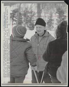 Former Eisenhower aide, Sherman Adams, is back on the job at his new $1.5 million Loon Mt. Ski development in Lincoln, N.H. following an operation at Hanover, N.H. Adams is shown at Loon Mt. welcoming a pair of eager young skiers.