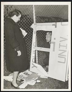 Fort Devens, Remains of torn signs, and debris are viewed by Mr. + Mrs. Robert Swan, who supposedly staged the entire affair at Devens.