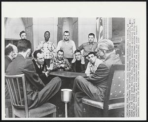 City Hall Subway Conference -- Moss Schenck, at table left, attorney for striking Motormen's Benevolent Association, gestures as he talks with William Peer, right, executive secretary to New York Mayor Robert Wagner, during conference on subway strike at City Hall yesterday. Looking on are representatives of the MBA and other transit workers unions.