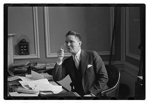 A man seated at a desk