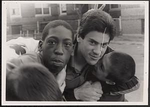 Three young men outside, laughing and making faces