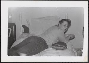 Young woman lying on a bed