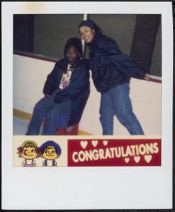 Two girls ice skating