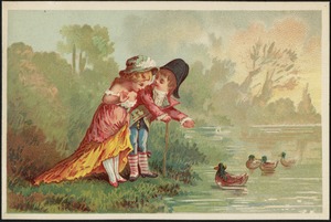 Boy and girl in historical costume at the water edge watching ducks swimming by.
