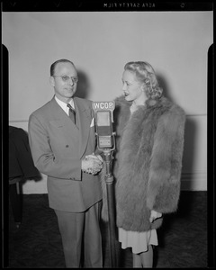 A. N. Armstrong and unidentified woman at WCOP microphone