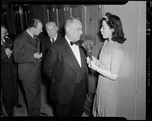 WAAB's Ruth Moss interviewing unidentified man at Boston Pops concert