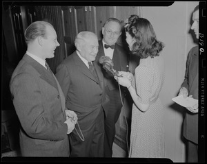 WAAB's Ruth Moss interviewing unidentified man at Boston Pops concert