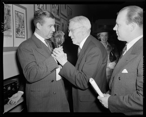 WAAB's Jack Stanley interviewing unidentified man at Boston Pops concert