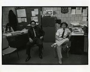 Two students sitting in a school office