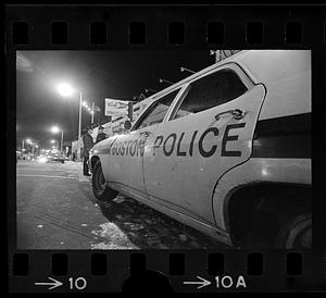 Police cruiser on the street at night, Mattapan