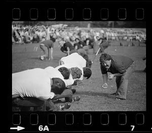 Man yells at tug of war competitors