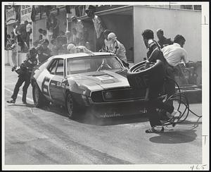 Mark Donohue brings the Penske Sunoco Javelin in the for the first pit stop at St. Jovite. He had to come back in for a forgotten gas cap but went on to win.