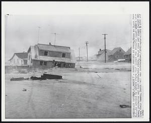 Homes Wrecked by Storm - House at Beach Haven, N.J., is wrecked by severe storm that lashed the Atlantic coast over a wide area, yesterday and last night. Gale winds, heavy snow and sleet forced man from their homes. Death toll was undetermined.