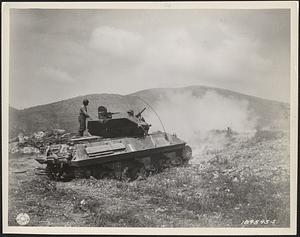 An M-10 Tank Destroyer, manned by the French crew of an Algerian division, fires on Castleforte during the latest push in Italy