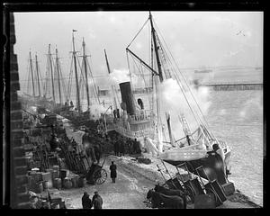Ice covered boats at pier